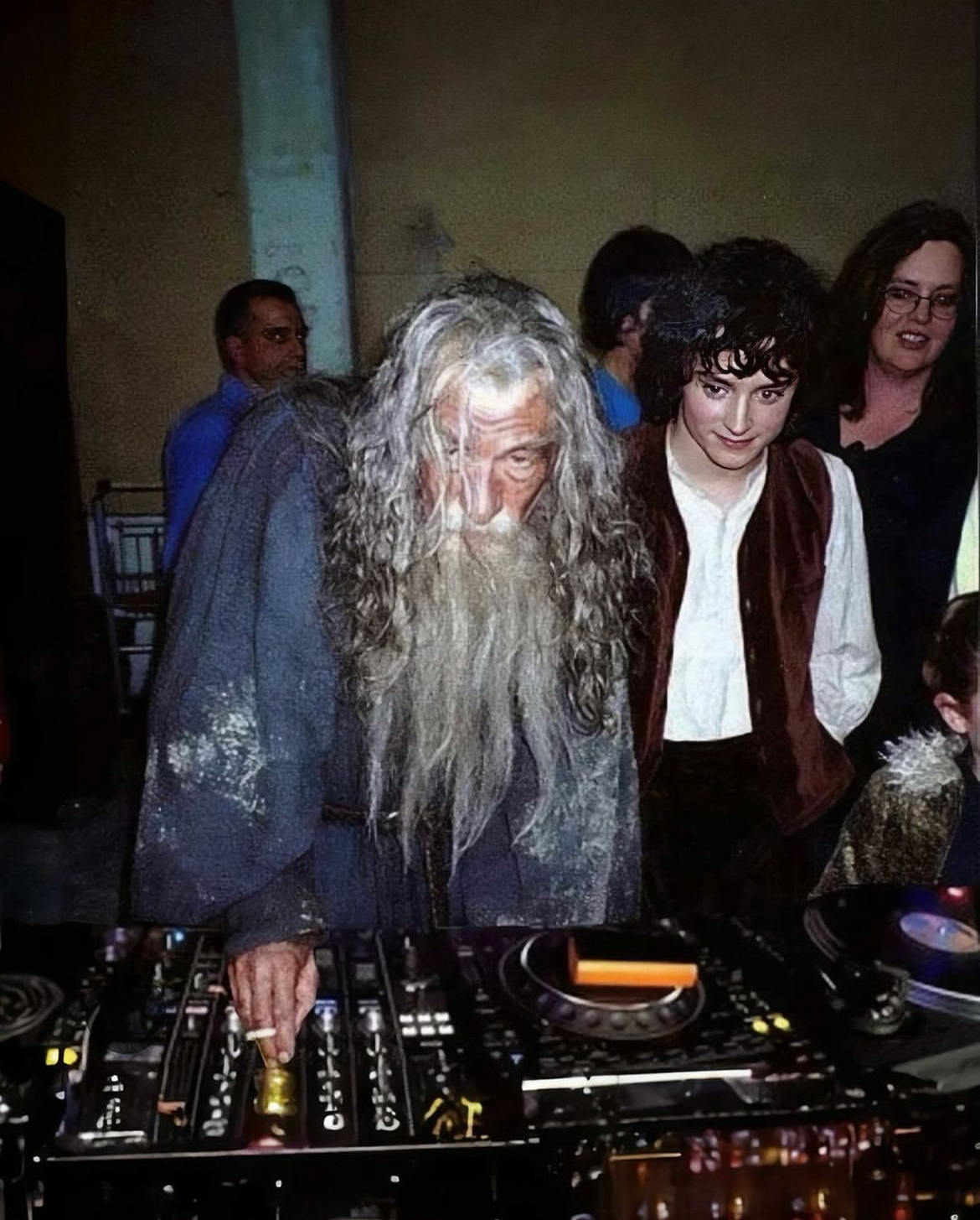 Gandalf (Sir Ian McKellen) and Frodo (Elijah Wood) at the DJ decks.